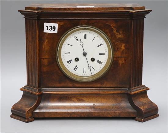 A late Victorian walnut cased eight day mantel clock height 25cm